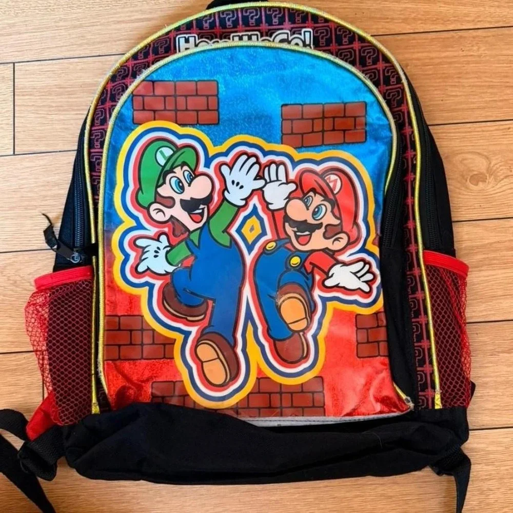 Nintendo Super Mario backpack with Mario and Luigi graphic on a brick background